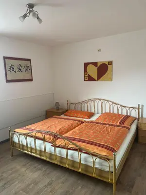 Ein Bett oder Betten in einem Zimmer der Unterkunft Ferienwohnung Niedermoosen