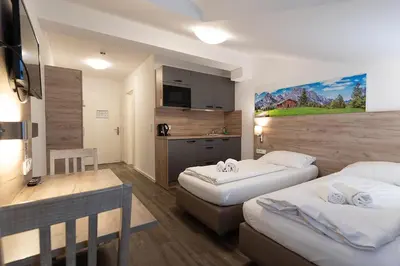 Ein Bett oder Betten in einem Zimmer der Unterkunft Aparthotel Oberfeld West München, Selbstversorgerhotel