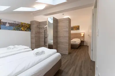 Ein Bett oder Betten in einem Zimmer der Unterkunft Aparthotel Oberfeld West München, Selbstversorgerhotel