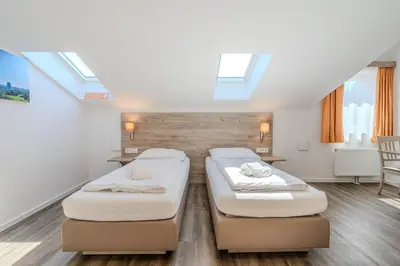 Ein Bett oder Betten in einem Zimmer der Unterkunft Aparthotel Oberfeld West München, Selbstversorgerhotel