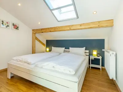 Ein Bett oder Betten in einem Zimmer der Unterkunft Ferienwohnung Auszeit | Chiemgau Karte