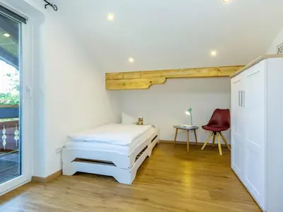 Ein Bett oder Betten in einem Zimmer der Unterkunft Ferienwohnung Auszeit | Chiemgau Karte