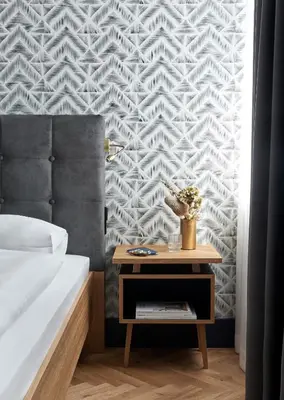 Ein Bett oder Betten in einem Zimmer der Unterkunft Hotel MIO by AMANO