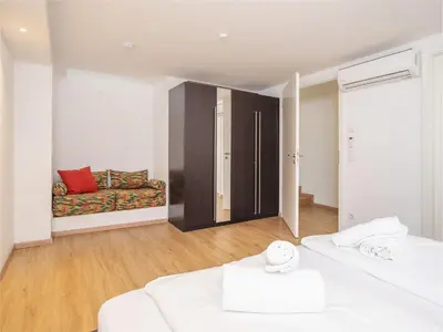 Ein Bett oder Betten in einem Zimmer der Unterkunft Moderne stilvolle Wohnung im Herzen Münchens