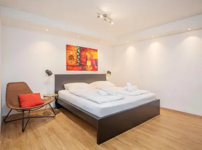 Ein Bett oder Betten in einem Zimmer der Unterkunft Moderne stilvolle Wohnung im Herzen Münchens