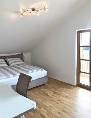 Ein Bett oder Betten in einem Zimmer der Unterkunft Ferienwohnungen Thum