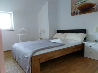 Ein Bett oder Betten in einem Zimmer der Unterkunft Haus am Schlossbach****