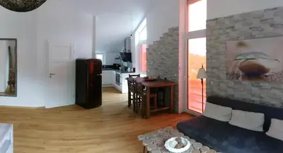 Ein Sitzbereich in der Unterkunft Haus am Schlossbach****