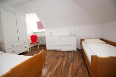 Ein Bett oder Betten in einem Zimmer der Unterkunft Hotel Olympia