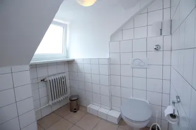 Ein Badezimmer in der Unterkunft Hotel Olympia