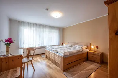 Ein Bett oder Betten in einem Zimmer der Unterkunft Ferienwohnung Wertenauer