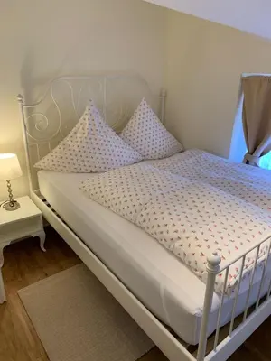 Ein Bett oder Betten in einem Zimmer der Unterkunft Ferienwohnung Giacomelli 3