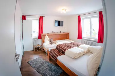 Ein Bett oder Betten in einem Zimmer der Unterkunft Haus Erli