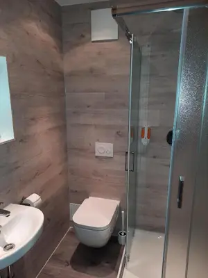 Ein Badezimmer in der Unterkunft Hotel Adler