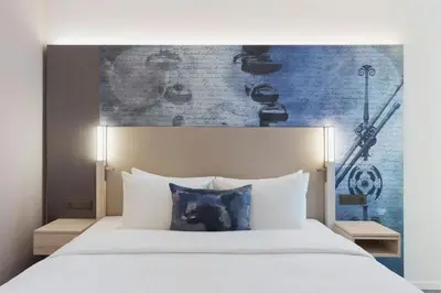 Ein Bett oder Betten in einem Zimmer der Unterkunft Courtyard by Marriott Munich Garching