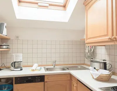 Küche/Küchenzeile in der Unterkunft Rottach Apartments - Ferienwohnungen am Tegernsee