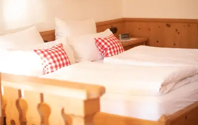 Ein Bett oder Betten in einem Zimmer der Unterkunft Rottach Apartments - Ferienwohnungen am Tegernsee