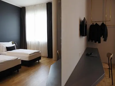 Ein Bett oder Betten in einem Zimmer der Unterkunft Bold Hotel München Giesing