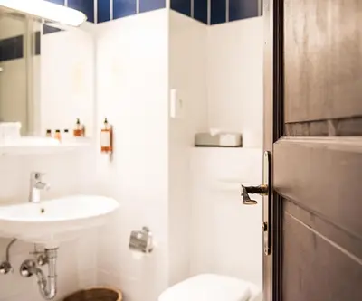 Ein Badezimmer in der Unterkunft Hotel Ritzi