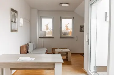 Ein Sitzbereich in der Unterkunft Hotel Freischütz Apartments
