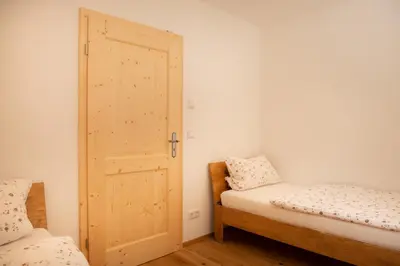 Ein Bett oder Betten in einem Zimmer der Unterkunft Ferienwohnung Glaserhäusl am Roßgarten