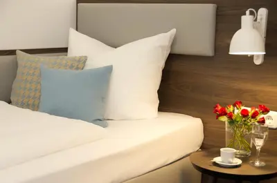 Ein Bett oder Betten in einem Zimmer der Unterkunft Lizz Hotel Munich
