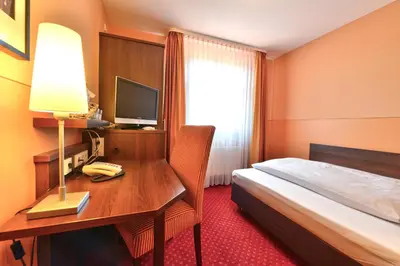 Ein Bett oder Betten in einem Zimmer der Unterkunft Hotel Auf Wolke 8