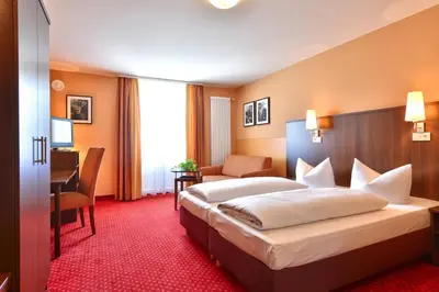 Ein Bett oder Betten in einem Zimmer der Unterkunft Hotel Auf Wolke 8