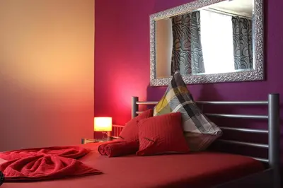 Ein Bett oder Betten in einem Zimmer der Unterkunft Lustra Stundenhotel - Adults Only