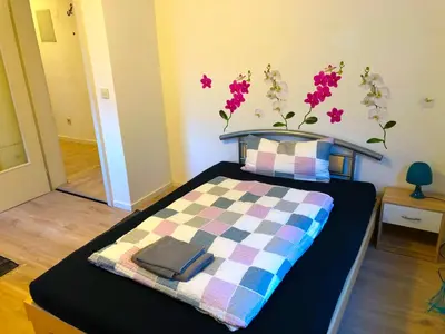 Ein Bett oder Betten in einem Zimmer der Unterkunft Ferienwohnung Fischach