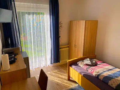 Ein Bett oder Betten in einem Zimmer der Unterkunft Ferienwohnung Fischach