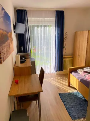 Ein Bett oder Betten in einem Zimmer der Unterkunft Ferienwohnung Fischach