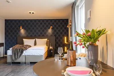 Ein Bett oder Betten in einem Zimmer der Unterkunft MASEVEN München Messe Dornach