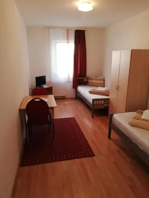 Ein Bett oder Betten in einem Zimmer der Unterkunft Pension Feldschlössl