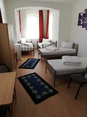 Ein Bett oder Betten in einem Zimmer der Unterkunft Pension Feldschlössl