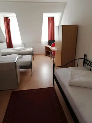 Ein Bett oder Betten in einem Zimmer der Unterkunft Pension Feldschlössl
