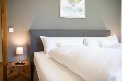 Ein Bett oder Betten in einem Zimmer der Unterkunft Ferienhaus „Adlerhorst“ eignet sich ideal für die ganze Familie