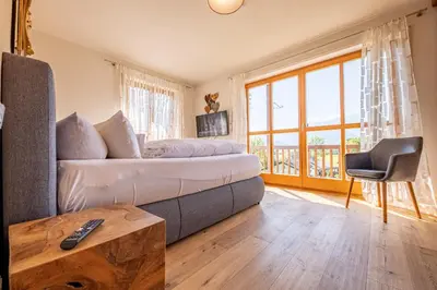 Ein Bett oder Betten in einem Zimmer der Unterkunft Ferienhaus „Adlerhorst“ eignet sich ideal für die ganze Familie