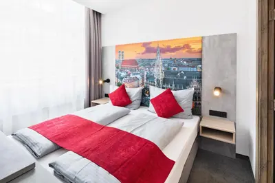Ein Bett oder Betten in einem Zimmer der Unterkunft Rimedya Hotel - an der Messe München