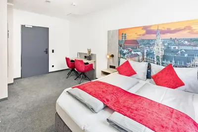 Ein Bett oder Betten in einem Zimmer der Unterkunft Rimedya Hotel - an der Messe München