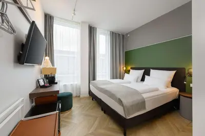 Ein Bett oder Betten in einem Zimmer der Unterkunft Flightgate Munich Airport Hotel, a member of Radisson Individuals