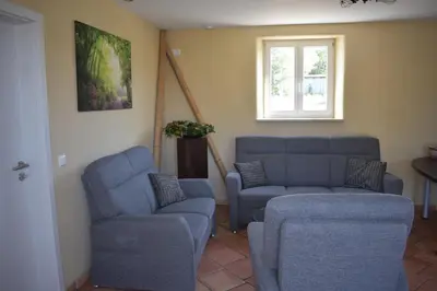 Ein Sitzbereich in der Unterkunft Palmengarten