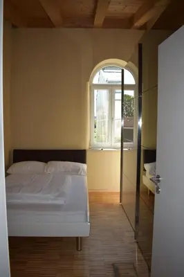 Ein Bett oder Betten in einem Zimmer der Unterkunft Palmengarten