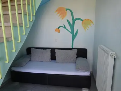 Ein Sitzbereich in der Unterkunft Palmengarten