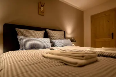 Ein Bett oder Betten in einem Zimmer der Unterkunft Chalet Sonnenbichl
