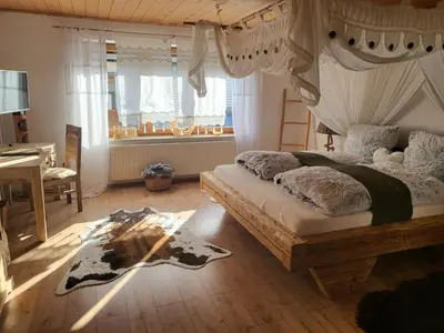 Ein Bett oder Betten in einem Zimmer der Unterkunft Ferienwohnungen Eisler