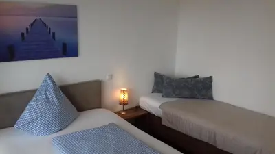 Ein Bett oder Betten in einem Zimmer der Unterkunft Ammergauer Vier Jahreszeiten