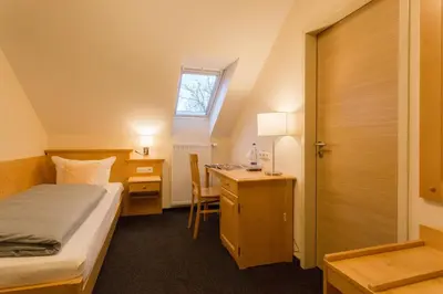Ein Bett oder Betten in einem Zimmer der Unterkunft Landhotel Grätz