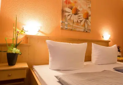 Ein Bett oder Betten in einem Zimmer der Unterkunft Landhotel Grätz