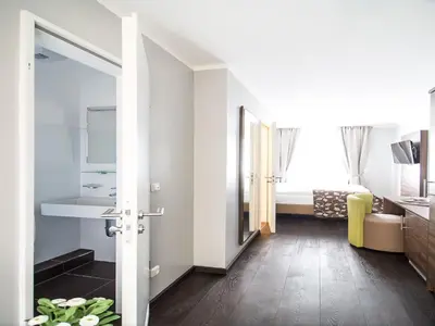 Ein Bett oder Betten in einem Zimmer der Unterkunft BATU Apart Hotel